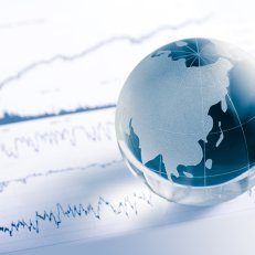 A blue and white globe sitting on a graph.