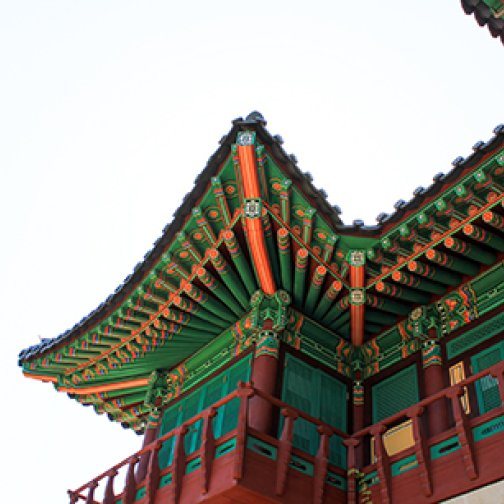 East Asian temple with red, green and orange paneling